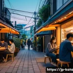 데이터 주권과 사회적 책임 - A modern Japanese cityscape at dusk, with people using smartphones and laptops in a cozy caf&eacute; settin...